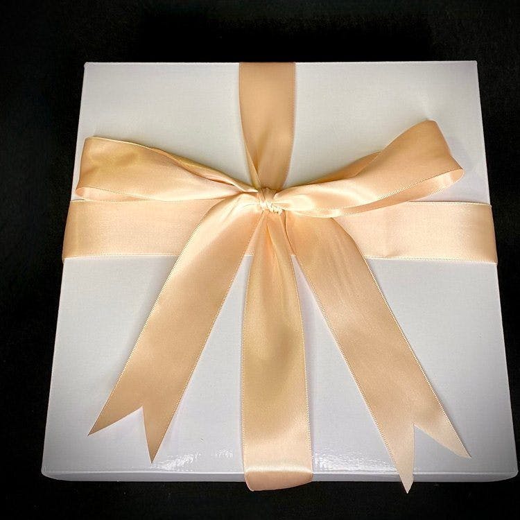 The Lady gift experience is a three layer gift that features: